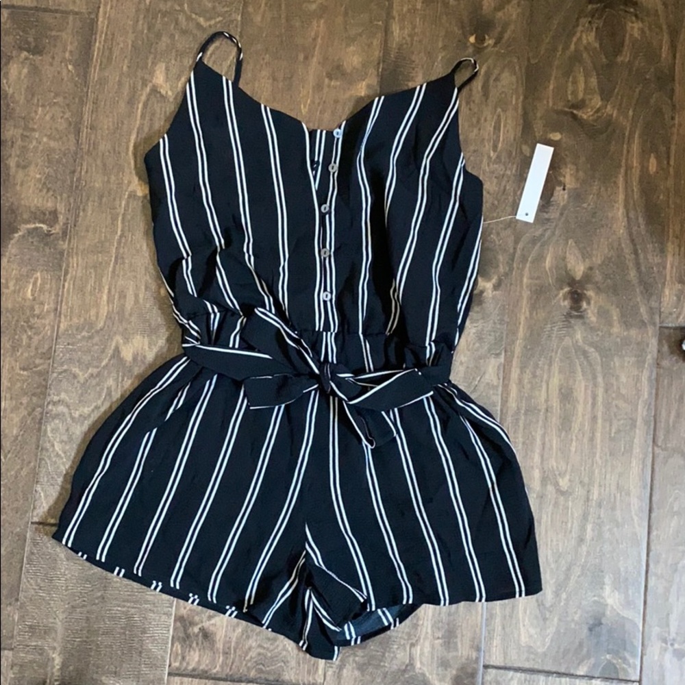 NWT. Black with white pinstripes romper.